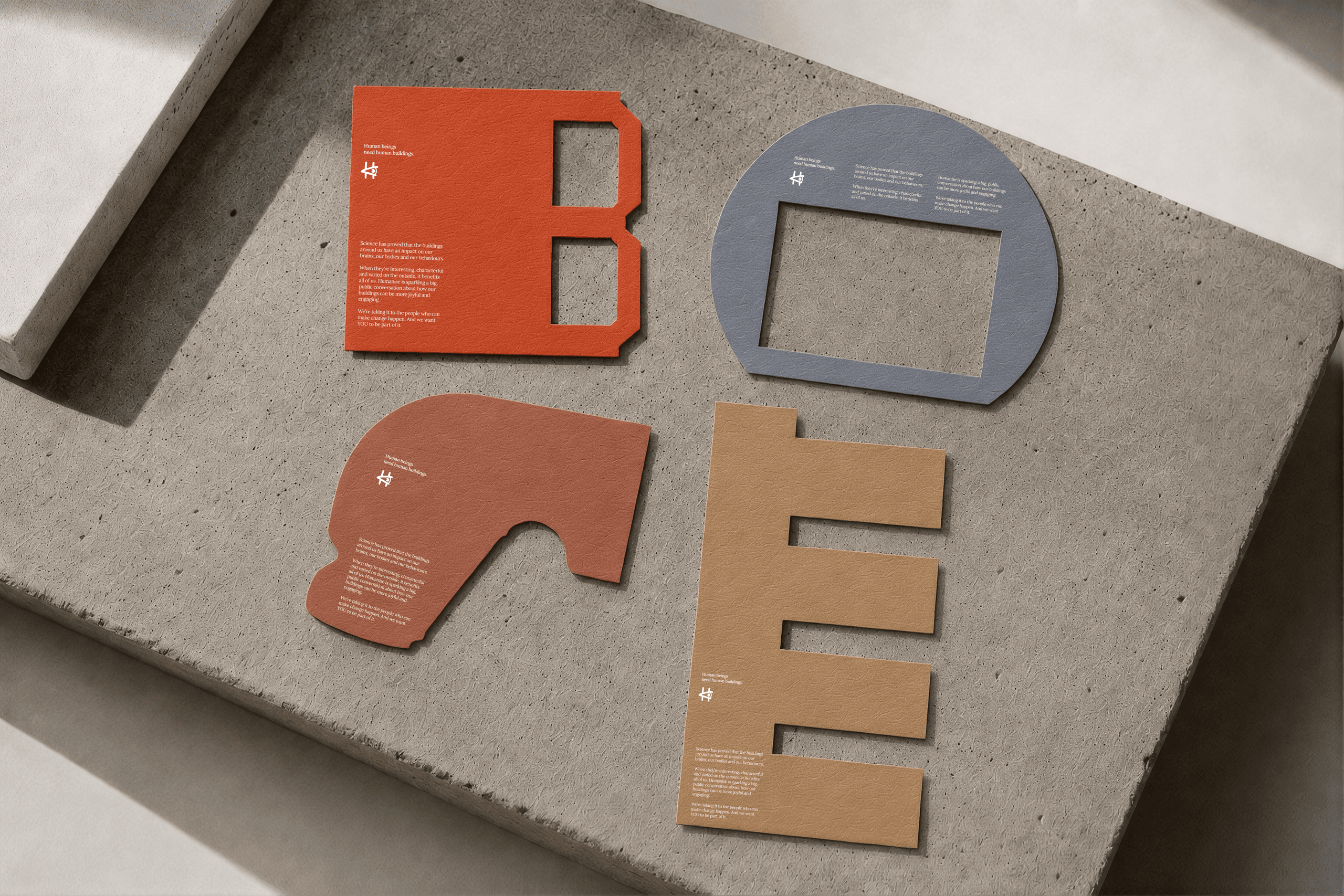 Image of a selection of different coloured cards which spell the word 'Bore' in the 'Humanise' typeface