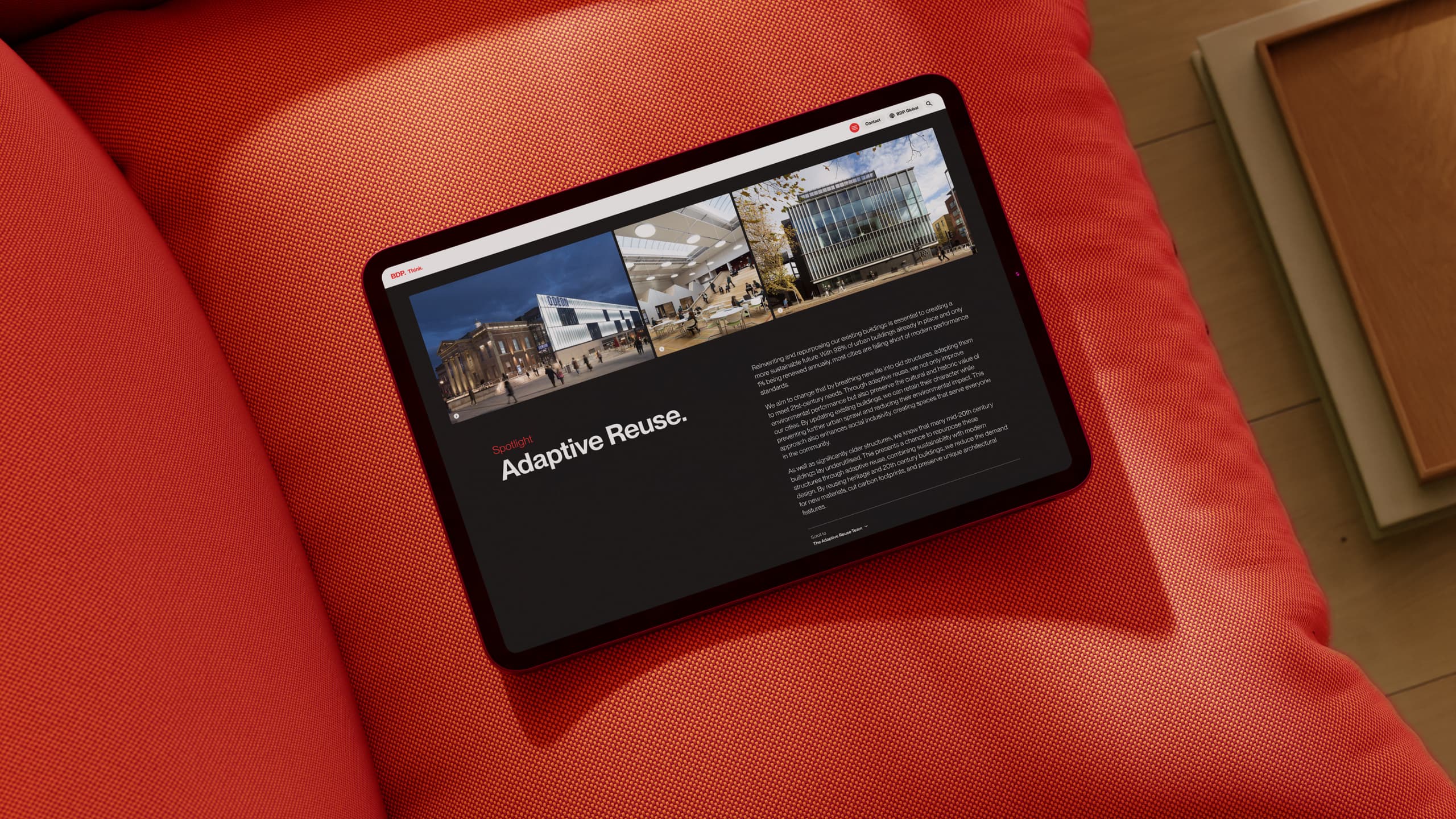 BDP website on ipad on red sofa